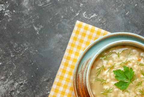 top-view-star-soup-bowl-dark-surface