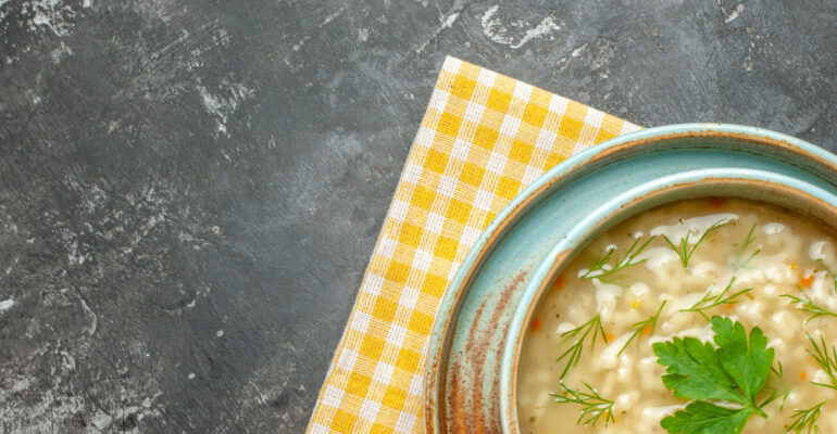 top-view-star-soup-bowl-dark-surface